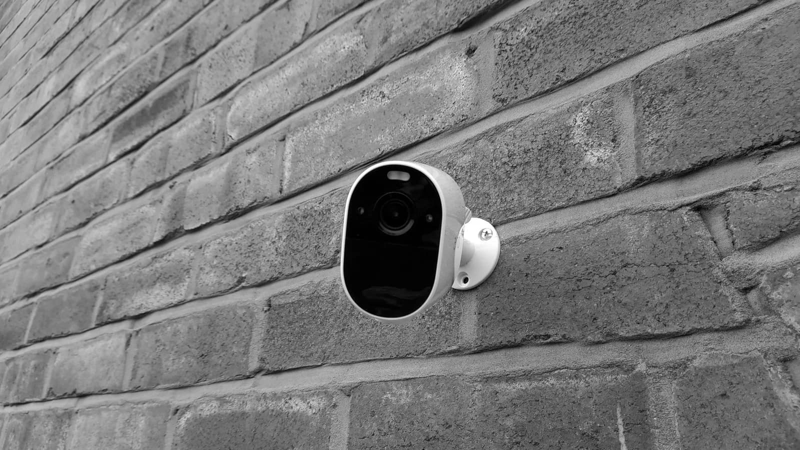 Security camera mounted on a brick wall