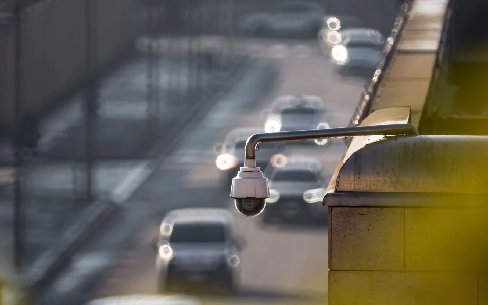 Security camera overlooking traffic on a city street